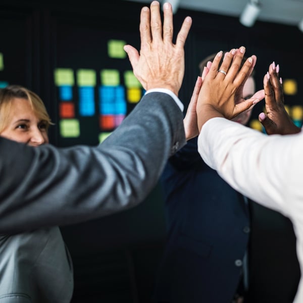 miniature team learning high five